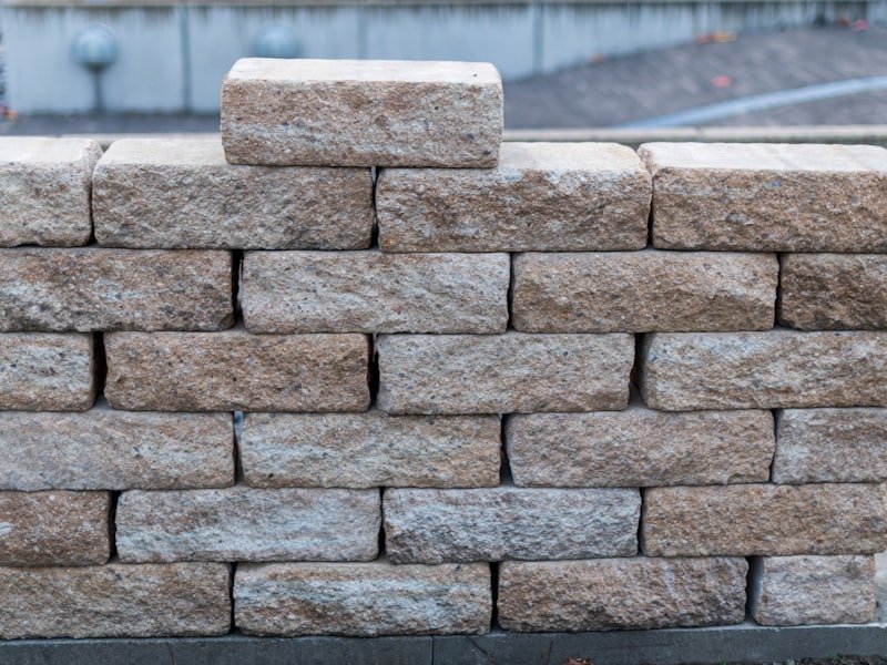 Large rough-cut natural armour stone blocks stacked in a wall